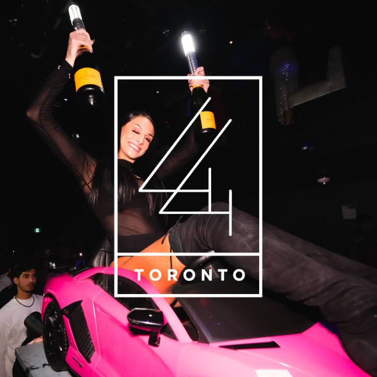 The 44 TORONTO logo on top of a Bottle Service server riding a pink lamborghini with bottles of champagne and lights