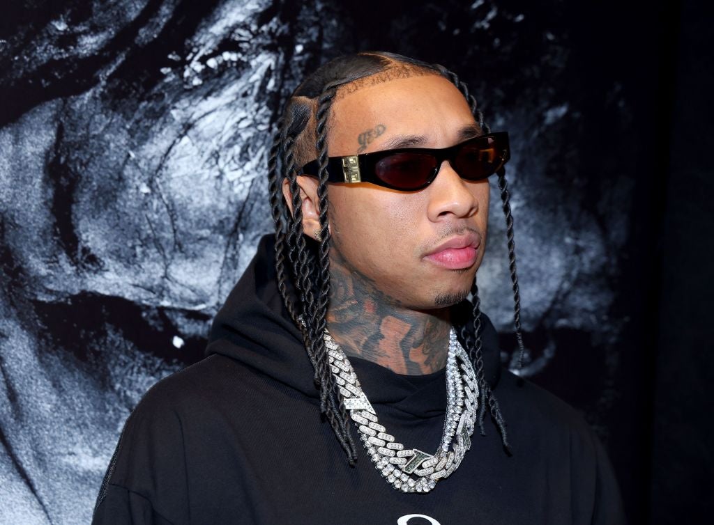Tyga in front of a black and white background